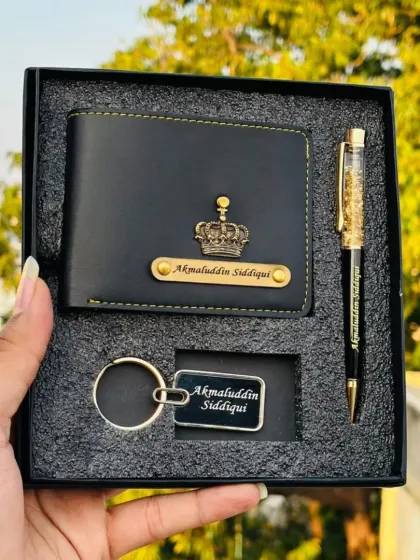 This compact gift set is perfect for any occasion, featuring a personalized faux leather wallet, a matching keychain, and a stylish pen. Each item is customized with a name and your choice of charm, presented in a sleek gift box.
