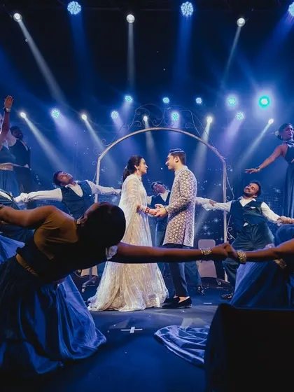 Choreography is more than just steps, it's about creating stunning visual formations. For this couple's entry, I had my professional dancers create a moving circle of light and motion, framing the couple in the center of the stage.
