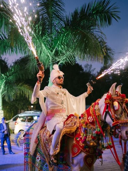 A classic groom entry on a beautifully decorated horse, complete with cold pyro guns for that extra dramatic flair. We make sure the groom's entry is as spectacular as the bride's.