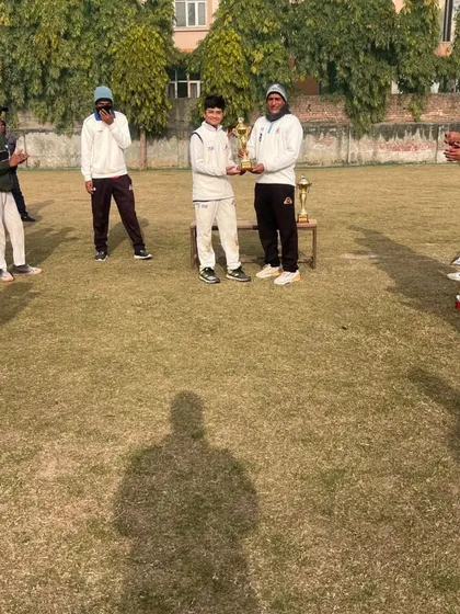 A young player receiving a trophy for his remarkable performance. These moments of recognition are huge confidence boosters.