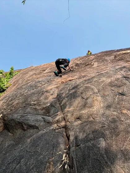 A young adventurer tackles a rock climbing challenge with focus and determination. We provide certified instructors and safe equipment to help participants push their limits and discover their strength.