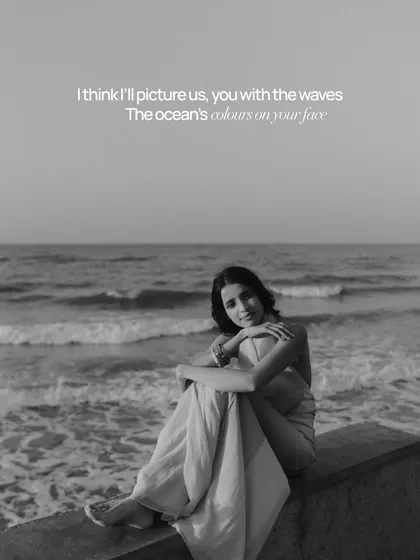 An artistic black and white portrait of the bride by the ocean, with a poetic text overlay. This image combines photography and verse to evoke a feeling of timeless romance and memory.