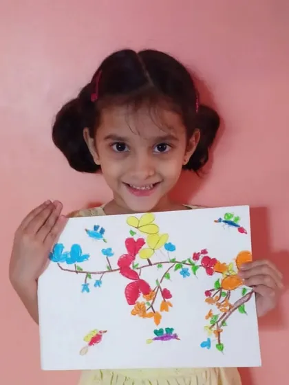 The joy of creating starts early at our academy. This is Ira, a 2nd standard student from one of our online classes, with her beautiful and colorful finger painting of birds and flowers.