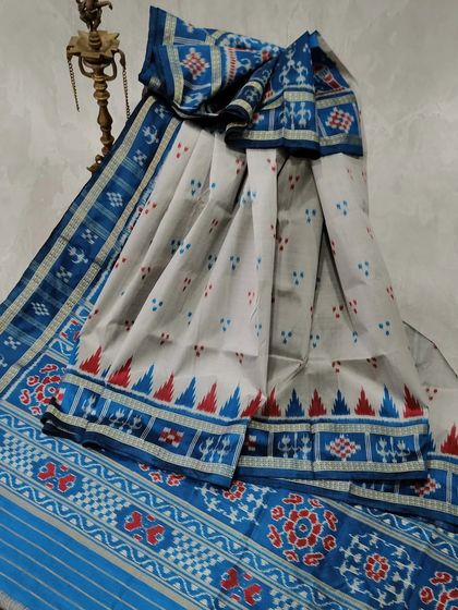 A Sambalpuri Ikkat cotton saree from Odisha. The combination of white, blue, and red, along with the temple border, is characteristic of this beautiful regional weave.
