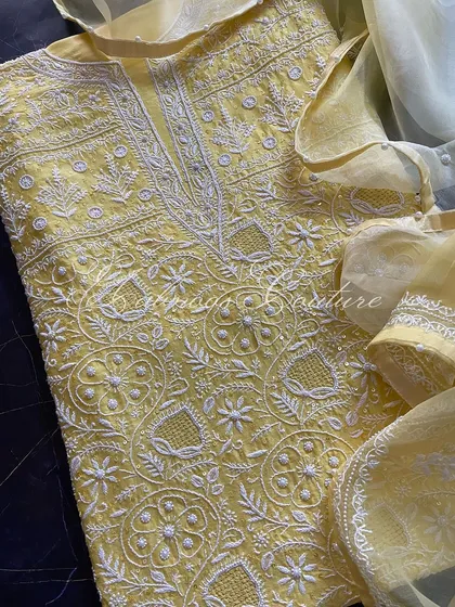 A flat-lay of the kurta and dupatta, showing the full design.