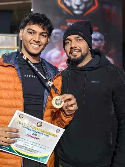 A young champion from my team with his medal and certificate. The future of our gym is bright.