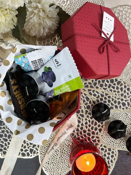 Unboxing the red hexagonal gift box for Diwali. It's a great option for a small, curated gift that still feels very special and festive.