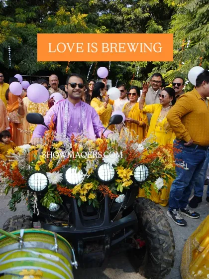 Another shot of the groom's fun-filled entry on the ATV, with guests cheering and balloons in the air. 'Love is Brewing' indeed.