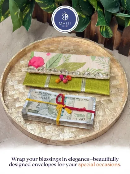 A beautifully designed floral envelope for your 'shagun'. This premium envelope, seen here on a mother-of-pearl inlay tray, turns a traditional gesture into a stylish statement.