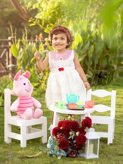 A beautiful, sunny smile from the birthday girl during her outdoor tea party. Celebrating milestones in nature always adds a special touch of magic.