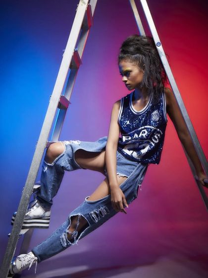 Incorporating props like a ladder to add an industrial, edgy element to this fashion shoot. Our studio space allows for the use of various props to create unique and memorable lookbook images.