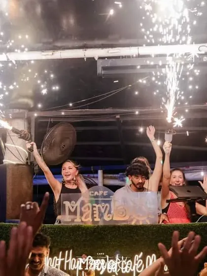 Celebrating Independence Day at Cafe Mambo with sparklers and a hyped-up crowd. I am experienced in DJing for special events and national holidays.
