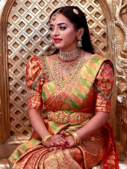 Pretty Lakshmishri looking royal for her event. I created a bold look with a classic red lip and defined eyes to match her regal attire and the grand setting.