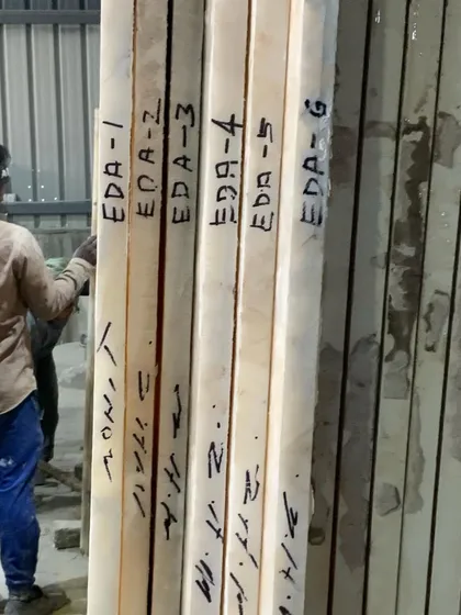 These marble slabs are marked with "EDA" for Elite Design Architects, ready to be transported to the site. I manage the entire procurement and selection process to guarantee the quality of materials used in your home.