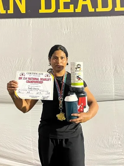 Holding my first-place certificate and prizes at the IDF National Deadlift Championship. A proud moment representing my gym, Vis Orbit.