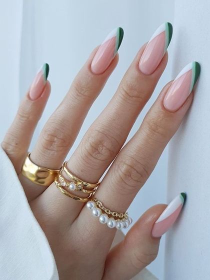 A unique tri-color French tip design. This long nail set features a clean design with white and green tips for a fresh, modern look.
