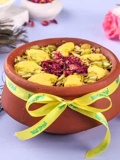 Our Rasmalai Matka cake is a true indulgence, topped with chunks of rasmalai, pistachios, and dried rose petals.