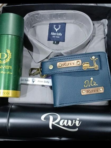 A stylish hamper featuring a grey Allen Solly shirt, a personalized wallet, and a custom name flask.