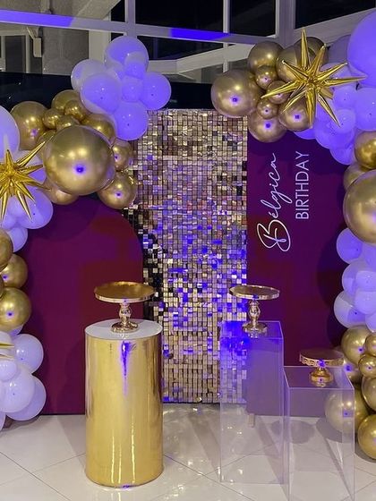 Under blue light, the shimmer wall and balloons take on a cool and futuristic feel.