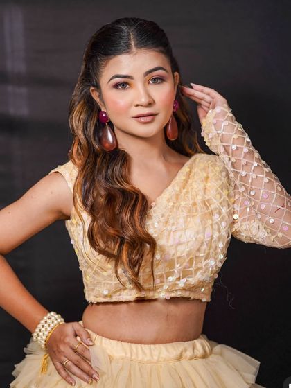 A closer look at the "Barbie" lehenga's one-shoulder blouse. The delicate sequin and lattice work on the sleeve adds a touch of glamour to this colourful and cheerful outfit.