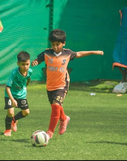 A young player from our U9 team shows great balance and control on the ball.