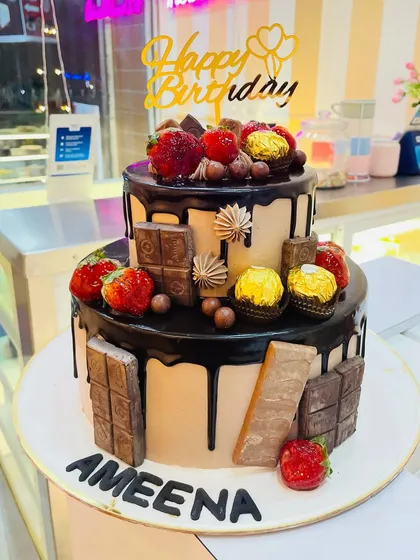 For the ultimate chocolate lover, this two-tier birthday cake is a dream come true. It's loaded with rich Belgian chocolate, Ferrero Rocher, fresh strawberries, and a decadent drip, showing our flair for creating indulgent and visually appealing chocolate cakes.
