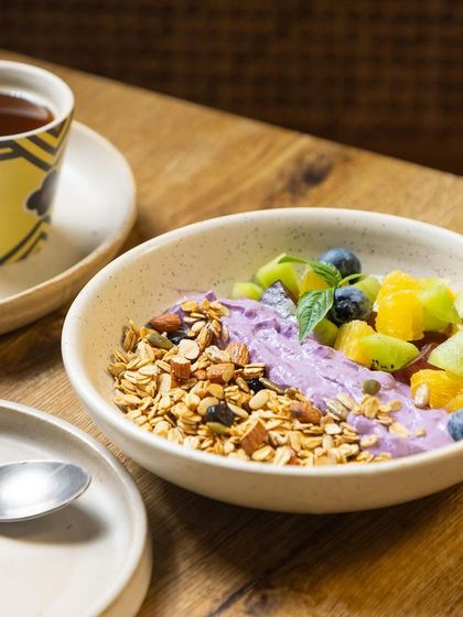 Another beautiful shot of our parfait, featuring creamy hung curd, crunchy granola, and a mix of fresh berries and exotic fruits. It's so tasty, you'll forget it's healthy.