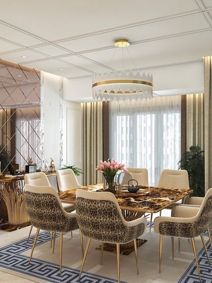 A dining room from the Versace-themed house, featuring a stunning patterned stone tabletop and chairs with animal-print upholstery. A large, faceted mirror wall expands the space and reflects the opulent details.