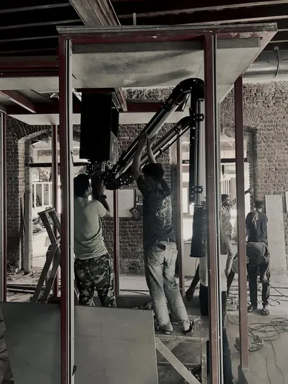 Our team on-site, carefully installing technical equipment within the structural frame. This hands-on involvement ensures every detail aligns with the overall design intent.