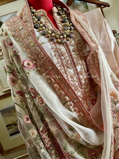 A full view of the styled suit, capturing its elegant silhouette.