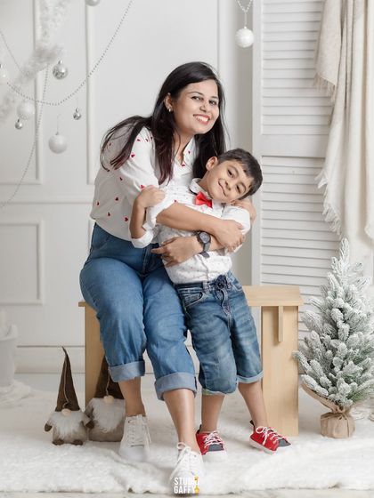 A heartwarming hug between a mother and her son during their Christmas mini-session.