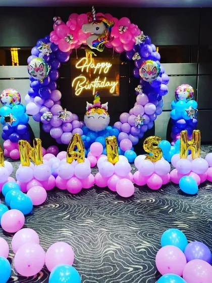 A magical unicorn theme for Anayra's birthday. The setup features a vibrant balloon ring, unicorn foil balloons, and the name spelled out in balloon letters.