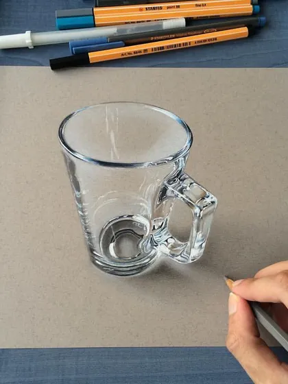 This is a realistic drawing of a glass coffee cup. Drawing transparent objects is a great test of skill, as you have to render both the object and what's seen through it.