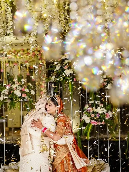 A beautiful, emotional hug between the bride and groom after the varmala ceremony.
