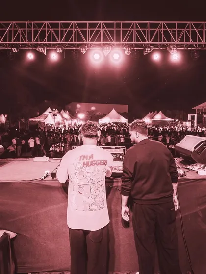 The view from behind the decks, looking out at a sea of people at a music festival. There's no feeling like controlling the energy of a crowd this size.