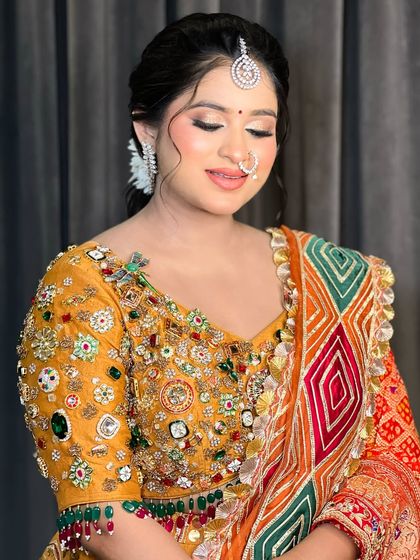 A close-up of the bride's makeup, with her eyes closed to show the soft, shimmery eyeshadow.