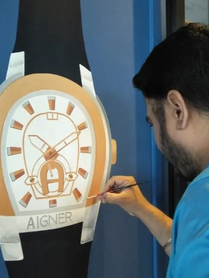 A closer look at the intricate brushwork on the Aigner watch mural. Precision is key in commercial art, and I take great care to ensure every detail is perfectly captured in my paintings.