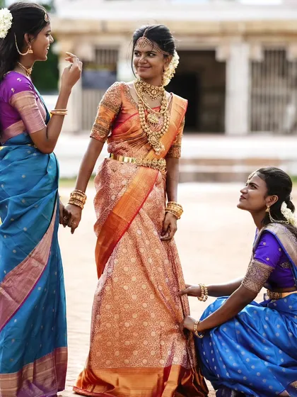 The bride with her bridesmaids. It's always fun getting the whole bridal party ready. Here, Swapna is the radiant center of attention.