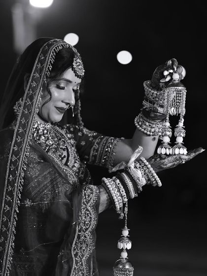 A beautiful black and white shot of my bride with her kalire. It captures the emotion and tradition of the moment.