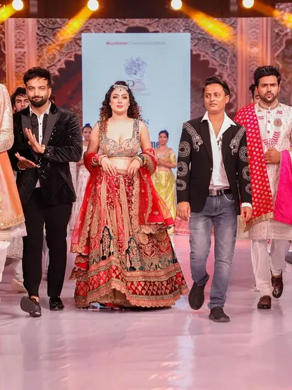 A proud moment on the runway at Lucknow Times Fashion Week, standing with our showstopper and fellow designer. We love bringing our vision to a larger audience.