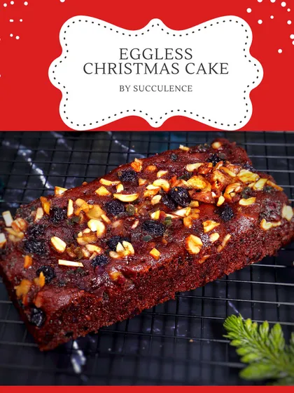A freshly baked eggless Christmas fruit loaf, rich with nuts and dried fruits. This loaf format is perfect for slicing and sharing with tea or coffee during the holiday season.