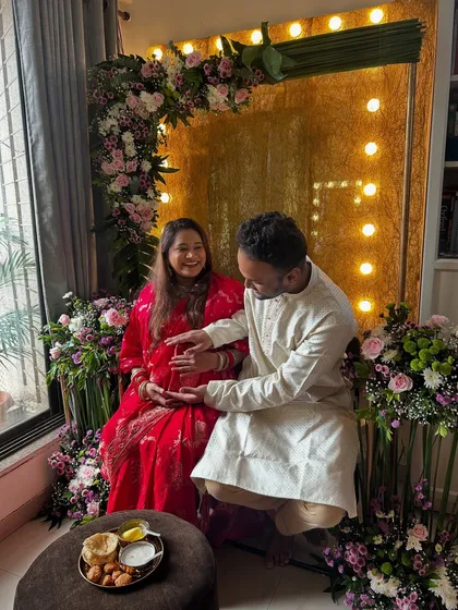A candid moment during the baby shower rituals. It's all about celebrating with family and loved ones.