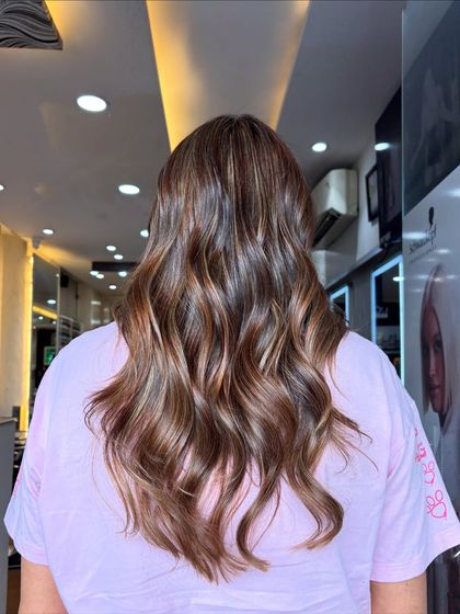 Serving smooth beige chocolate realness. This balayage combines cool beige tones with a rich chocolate base for a stunning result.