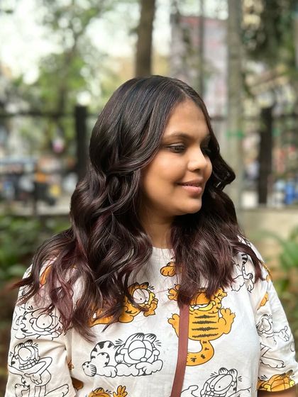 Our Cherry Choco balayage blend. This look combines deep chocolate tones with hints of cherry red for a subtle yet playful effect.