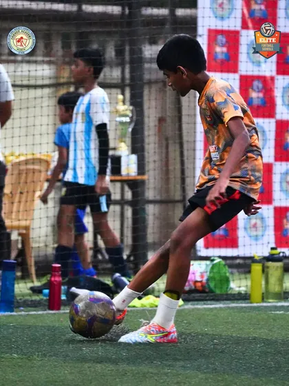 A player prepares to make a pass, demonstrating good technique and awareness during a Friends' Cup fixture.