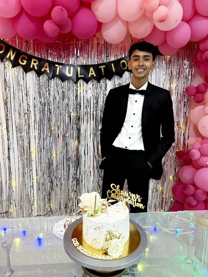 A happy client celebrating his Confirmation with a cake I designed for the occasion. It's wonderful to see my creations as part of such important spiritual milestones.