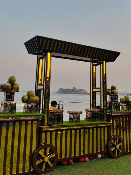 The coconut water station with a stunning island view, showcasing how I adapt my setups to beautiful locations.