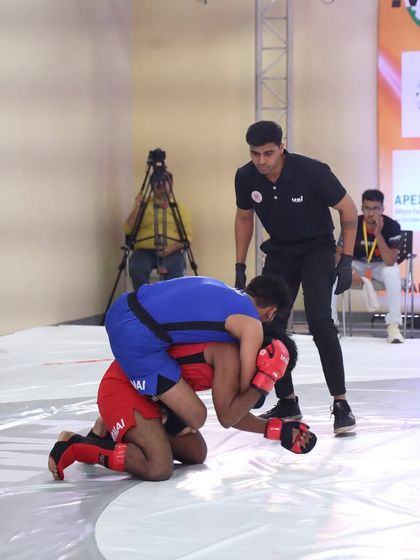 Action shot from the FMAAI National Championship in Mumbai. Our fighter working for a dominant position in a high-stakes MMA bout.