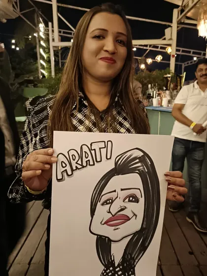 A guest named Arati with her portrait. The rooftop setting of Sky Lounge makes for a great atmosphere.