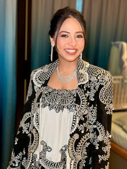 A happy and confident portrait. The soft glam makeup with a defined eye and glowing skin is a versatile look for any wedding guest.